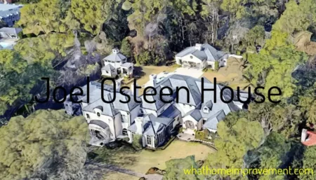 Aerial view of Joel Osteen's large stone mansion in River Oaks Houston, showing gray roof, mature trees, curved driveway and expansive landscaped grounds.
